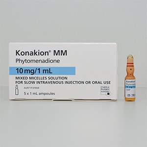 Medication box with the name Konakion MM. A vial next to the box.