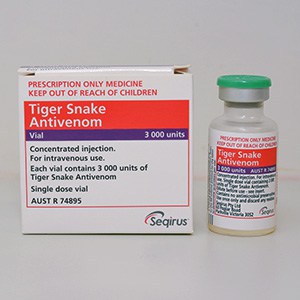 Medication box with the name Tiger Snake Antivenom. A vial next to the box.