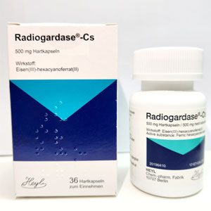 Medication box with the name Radiogardase -Cs. A white medicine bottle next to the box.