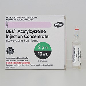 Medication box with the name DBL Acetylcysteine Injection Concentrate. Next to the box is a vial.